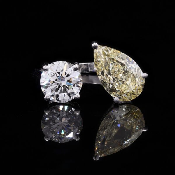 Contemporary ring studded eith yellow diamond and round Solitare diamond